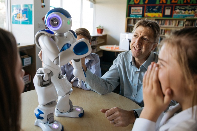 Student, teacher with robot