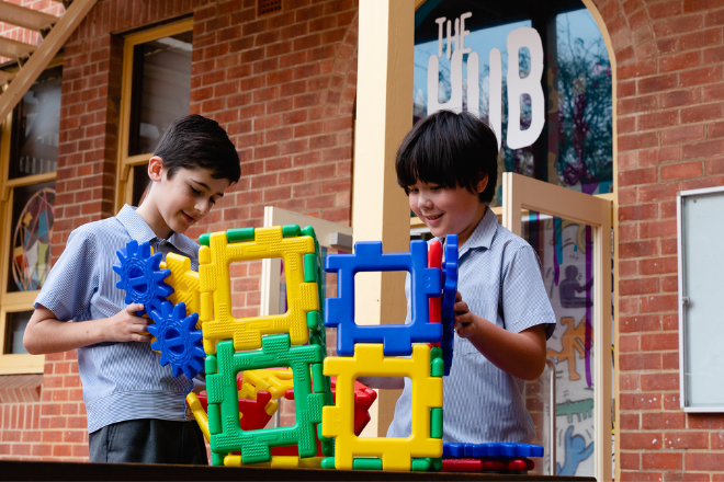 2 boys playing with blocks